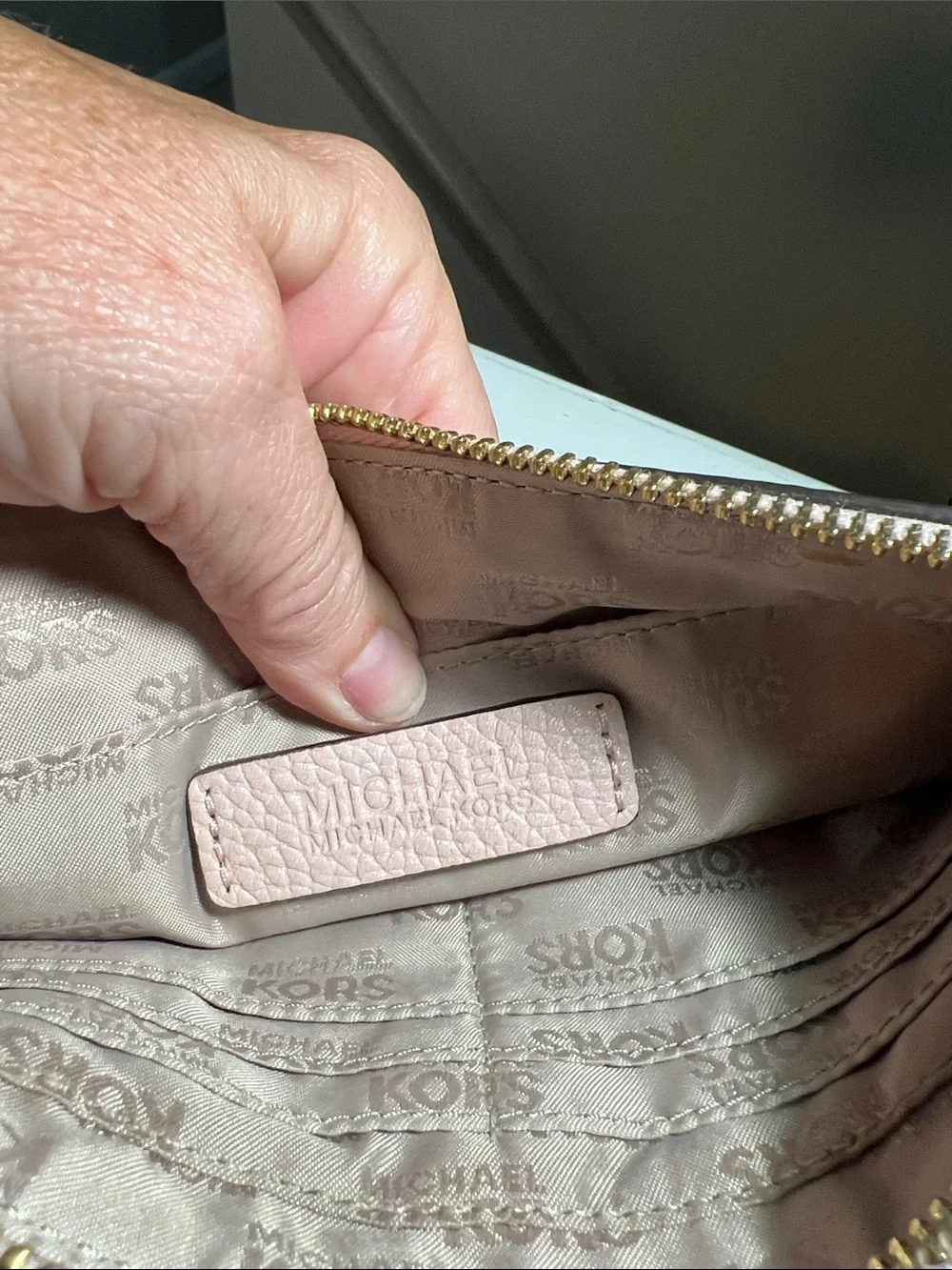 Michael Kors Blush Pebbled Leather Zip Clutch with Gold MK Logo